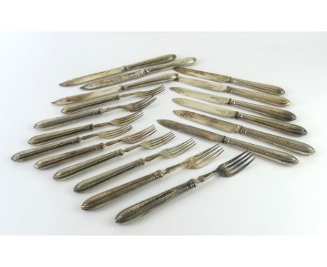 A collection of silver forks and knives, comprising three fish knives, three fish forks, six table knives and six table forks
