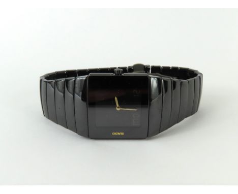 Rado - a gentleman's Diastar quartz wristwatch, the square black dial with analogue and digital display and gold hands, on a 