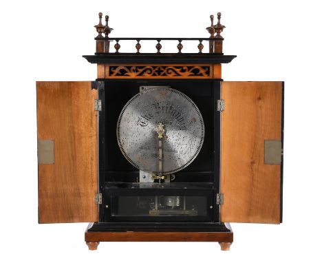 A walnut vertical Buffet type cabinet music box with 11 inch discsBarnett Henry Abrahams, St. Croix and London, late 19th cen