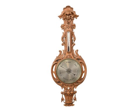 A Victorian carved oak mercury wheel barometerUnsigned, circa 1860The 11.5 inch circular star-centred silvered register calib