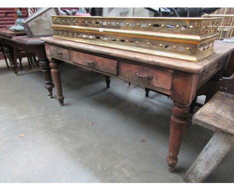 An Edwardian oak and pine desk with three drawers, stamped ER VII, 92 x 153cm