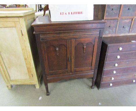 An oak cased gramophone in cabinet 