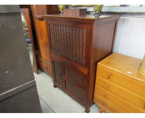 A modern Oriental cupboard with pull-out desk, filing drawer, etc