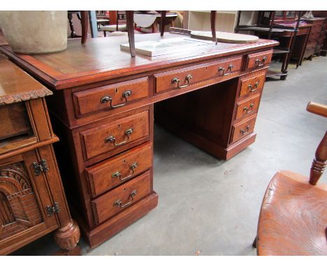 A mahogany twin pedestal desk with leather inset top    137 x 76 cm  