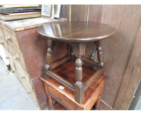 A circular oak lamp table