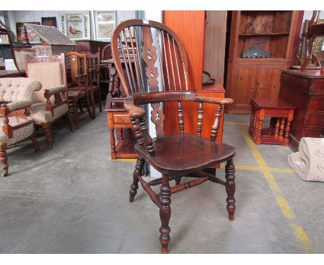 A set of four stick-back Windsor chairs