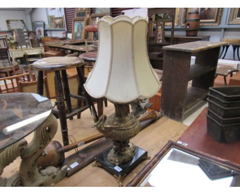 A gilded table lamp with swans on marble base