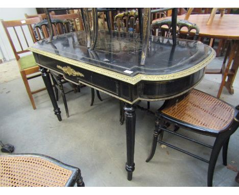 An ebonised brass inlaid D-end table/desk with drawer