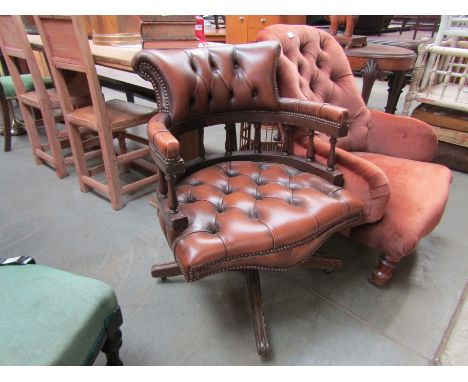 A leather revolving desk chair 