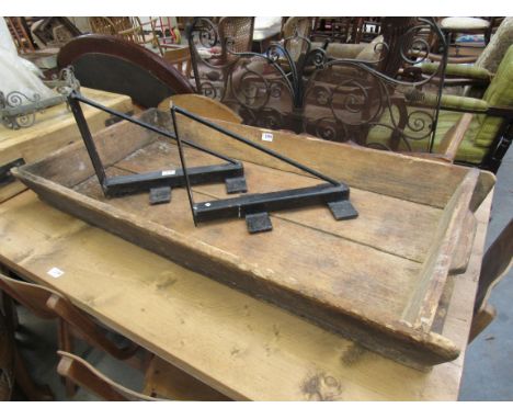 A large rustic dough trough/bin