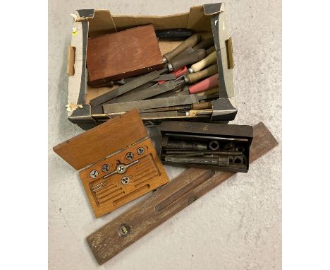 A box of assorted vintage tools to include files and a level.  