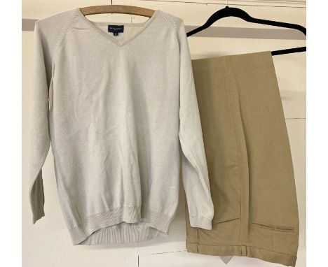 A pair of  women's brushed cotton classic tan golf trousers by Burberry.  Together with a beige golf v neck cotton jumper by 