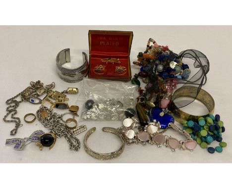 A small collection of vintage and modern costume jewellery.  To include bangles, pendants and necklaces. 