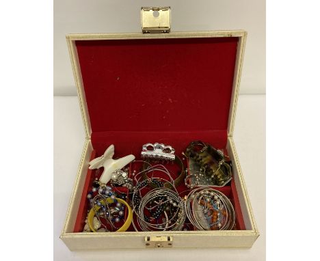 A vintage jewellery box and contents. To include costume jewellery bracelets, bangles and rings.  