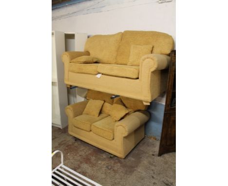 A MODERN TWO PIECE SUITE CONSISTING OF A THREE SEATER AND A TWO SEATER SOFA