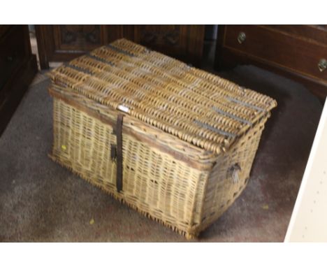 A LARGE WICKER TRAVEL TRUNK / PROPS BASKET