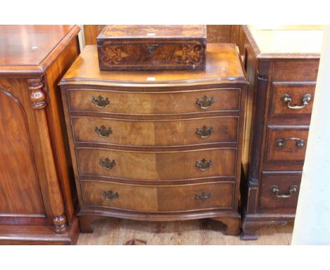 Walnut serpentine front chest of four long graduated drawers on shaped bracket feet, 83cm by 78cm by 51cm.