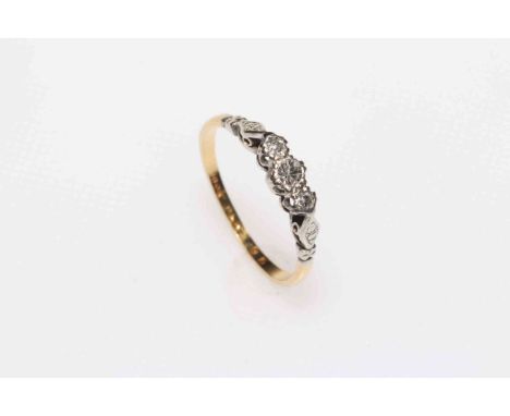 18 carat gold and three stone diamond ring, size M/N.