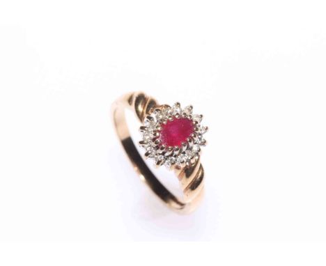Ruby and diamond cluster, 9 carat gold ring, size L.