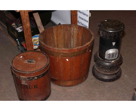 Vintage flour bin, half barrel planter and a vintage Valor heater.