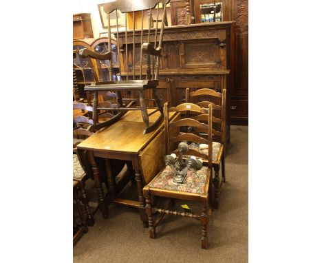Carved oak court cupboard, oak gate leg dining table and five ladder back dining chairs.