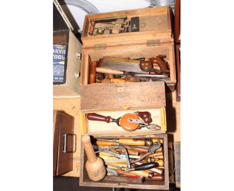Four boxes of wood chisels and carpentry tools.