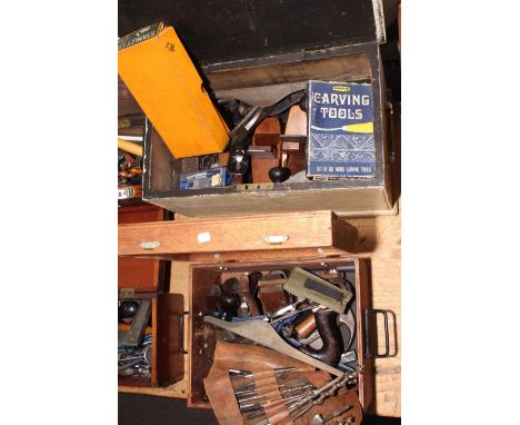 Two boxes of planes and carpentry tools.