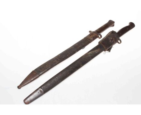 Two bayonets and scabbards, both blades by Wilkinson, one dated 1907.