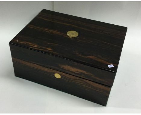 A calamander wood and brass mounted tea caddy. Est. £20 - £30.