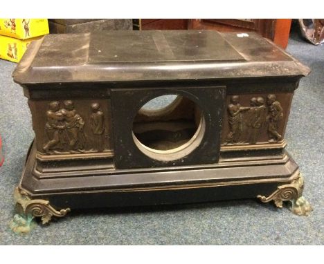 A large slate clock mount decorated with brass figures. Est. £15 - £20.