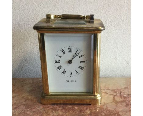 A brass cased carriage clock with white enamelled dial. Retailed by Mappin &amp; Webb. Est. £30 - £50.