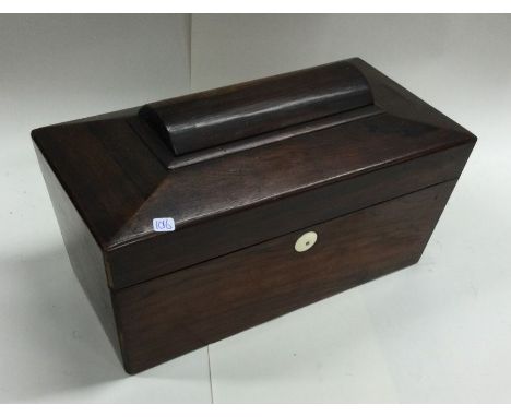 A rosewood shaped tea caddy with fitted interior. Est. £10 - £20.