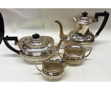A good heavy silver four piece half fluted tea service. London. By WRS. Approx. 1915 grams. Est. £700 - £800.