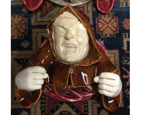 An unusual Austrian glazed lamp mount in the form of a hooded gargoyle. Est. £20 - £30.