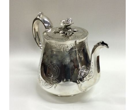 A good engraved silver teapot with flush fitting lid to flower finial. London 1850. By George Angel. Approx. 657 grams. Est. 