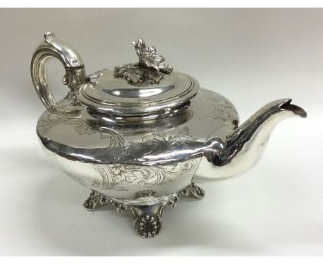 A fine quality William IV silver teapot attractively decorated with scrolls and flowers. London 1837. By Richard Pearce &amp;