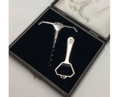 A stylish boxed silver corkscrew together with matching bottle opener. Birmingham. Approx. 116 grams. Est. £50 - £80.