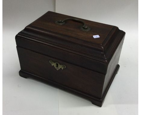 A Georgian mahogany hinged top caddy. Est. £40 - £60.