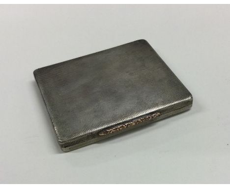 A silver engine turned cigarette box with hinged lid. Birmingham. Approx. 121 grams. Est. £60 - £80.