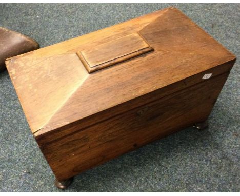 A Georgian rosewood sarcophagus shaped tea caddy with hinged top. Est. £20 - £30.