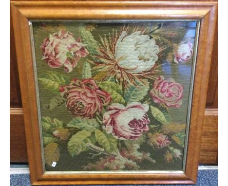 A maple framed and glazed tapestry depicting flowers. Approx. 37 cms x 38 cms. Est. £20 - £30.