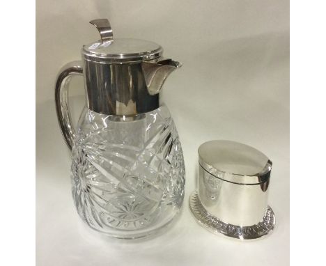 A large silver plated lemonade jug together with a tea caddy. Est. £20 - £30.