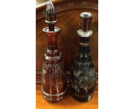 Two ruby glass etched decanters. Est. £20 - £30.