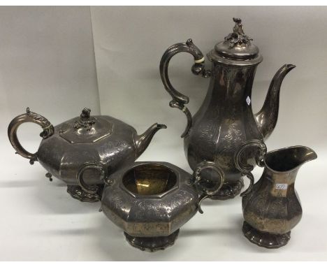 A good quality Victorian silver four piece tea and coffee service decorated with flowers and leaves. London. By George Fox. A