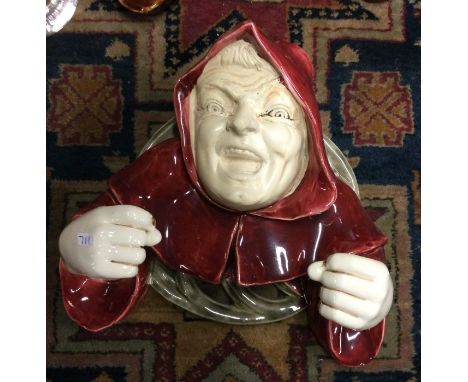 An unusual Austrian glazed lamp mount in the form of a hooded gargoyle. Est. £20 - £30.