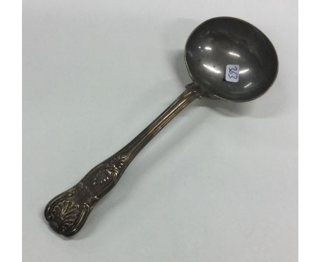 A Kings' pattern silver sauce ladle. London. Approx. 85 grams. Est. £20 - £30.