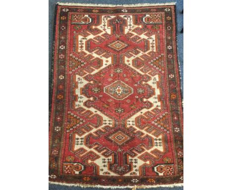 An old tapestry rug. Est. £30 - £50.