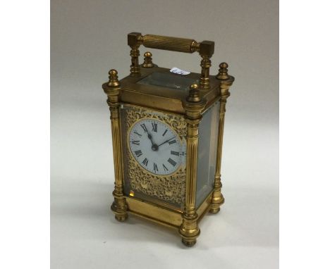 A rectangular brass mounted carriage clock of turned form with white enamelled dial. Est. £40 - £60.