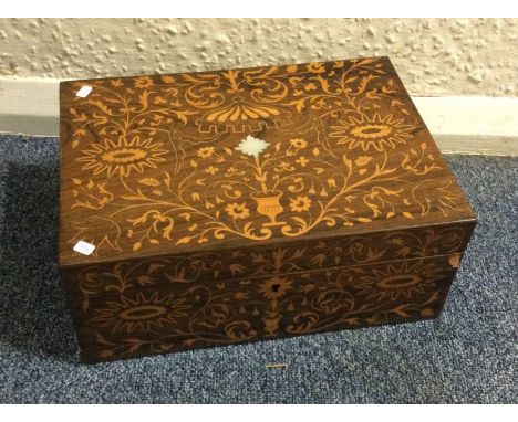 A mahogany and satinwood inlaid caddy. Est. £60 - £80.