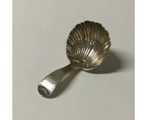 A heavy silver caddy scoop with fluted bowl. Sheffield. By TB. Approx. 17 grams. Est. £20 - £30.